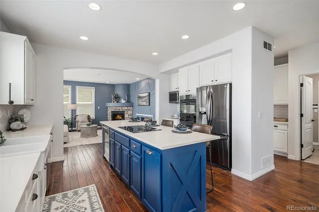 a bedroom with a bed wooden floor and window