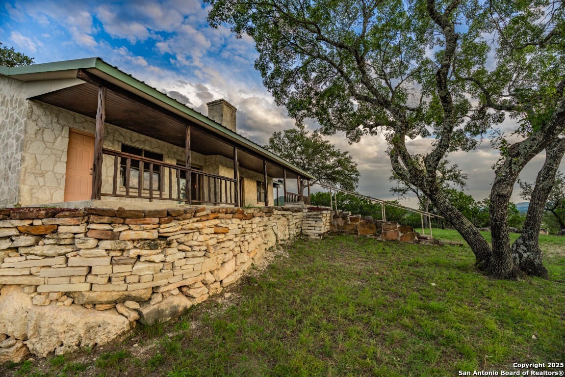 599 Mountain View Road Utopia, TX 78884 - Photo 17 of 38 a view of a house with a yard