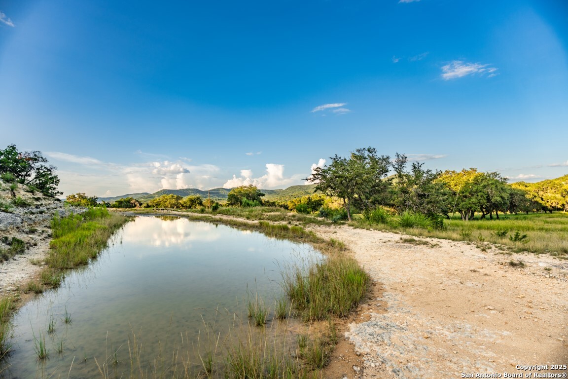 599 Mountain View Road Utopia, TX 78884 - Photo 19 of 38 a view of a lake with outdoor space