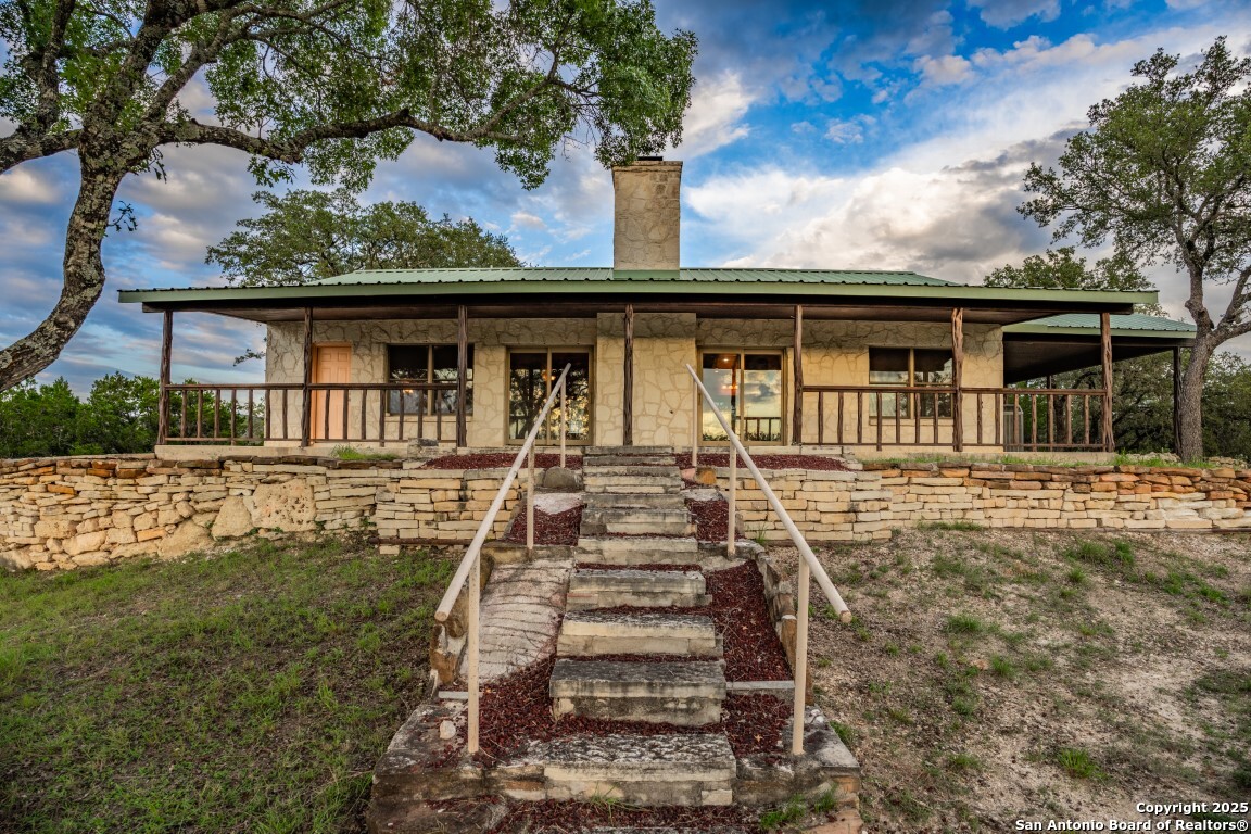 599 Mountain View Road Utopia, TX 78884 - Photo 2 of 38 front view of a house with a yard