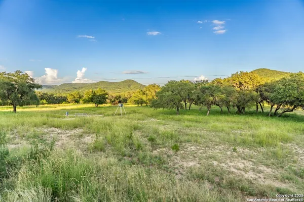 a view of a lake with a big yard