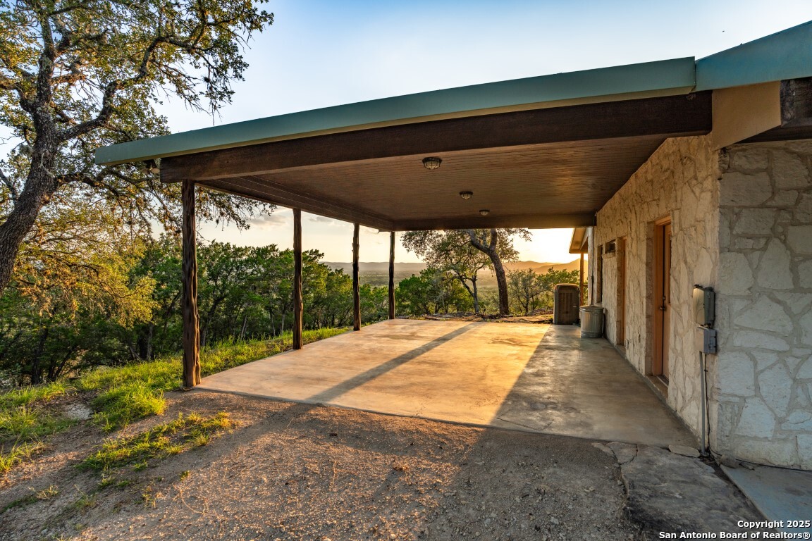 599 Mountain View Road Utopia, TX 78884 - Photo 38 of 38 a view of empty room with wooden floor and fence