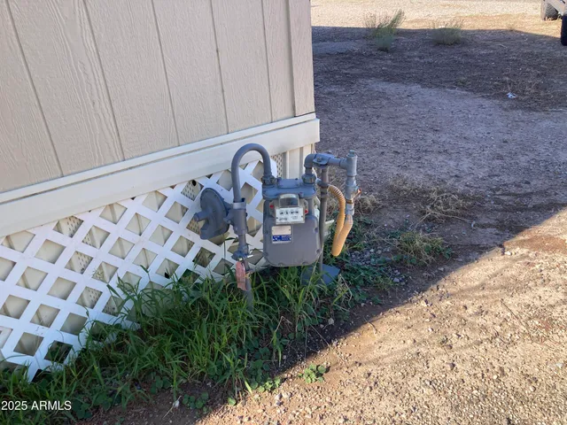 a sign board with wooden fence