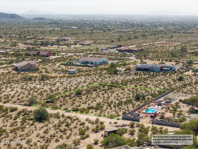 an aerial view of residential building and parking space
