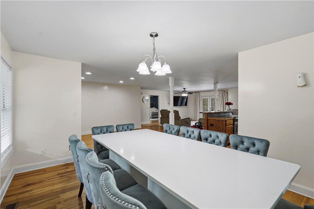 262 Iron Hill Road Taylorsville, GA 30178 - Photo 14 of 38 a view of a dining room with furniture and wooden floor