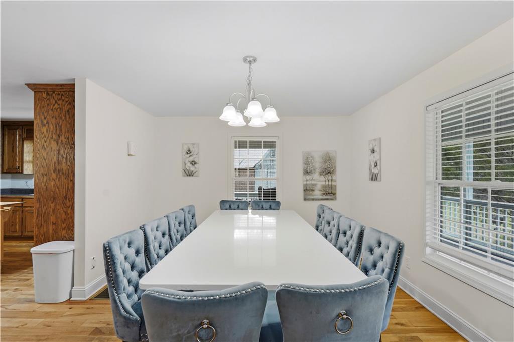 262 Iron Hill Road Taylorsville, GA 30178 - Photo 15 of 38 a dining room with furniture a rug and wooden floor