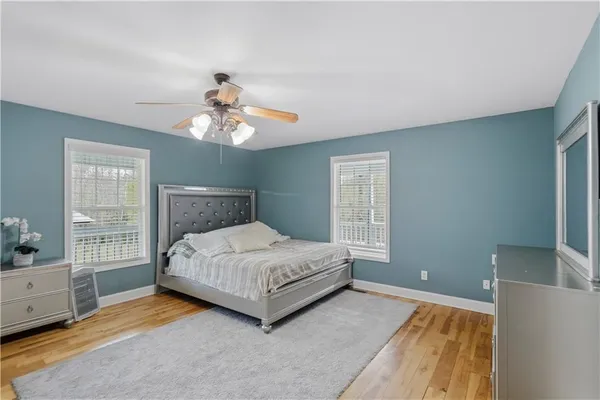 a bedroom with a bed and window