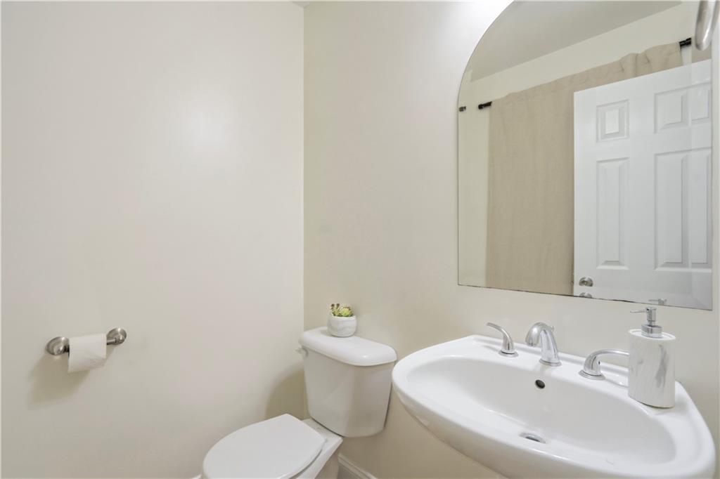 262 Iron Hill Road Taylorsville, GA 30178 - Photo 28 of 38 a bathroom with a sink a toilet and mirror