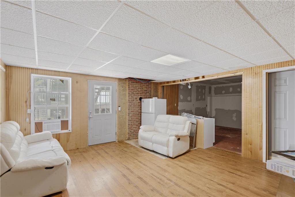 262 Iron Hill Road Taylorsville, GA 30178 - Photo 29 of 38 a living room with furniture and a large window