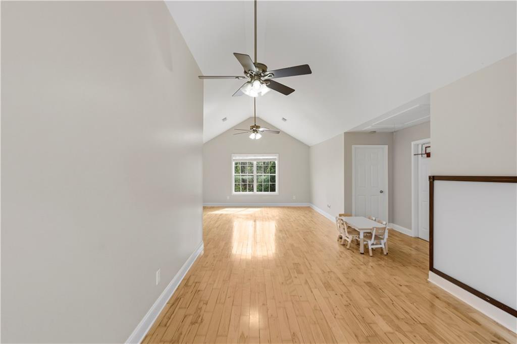 262 Iron Hill Road Taylorsville, GA 30178 - Photo 3 of 38 a view of empty room with wooden floor and fan