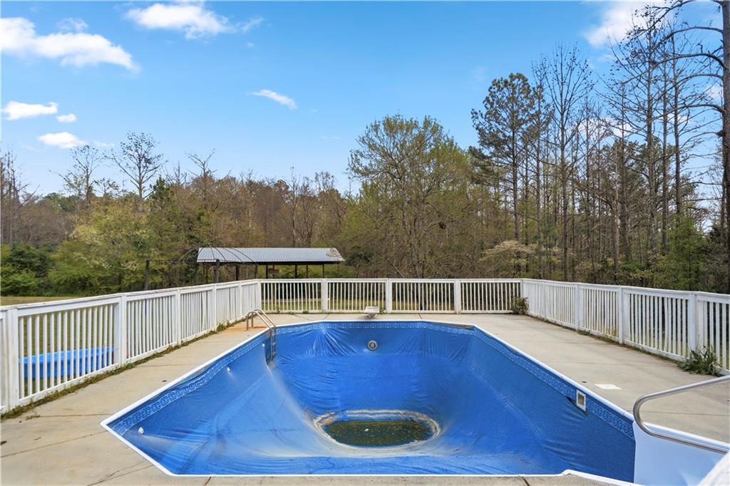 262 Iron Hill Road Taylorsville, GA 30178 - Photo 33 of 38 a view of a chairs and table on the wooden floor
