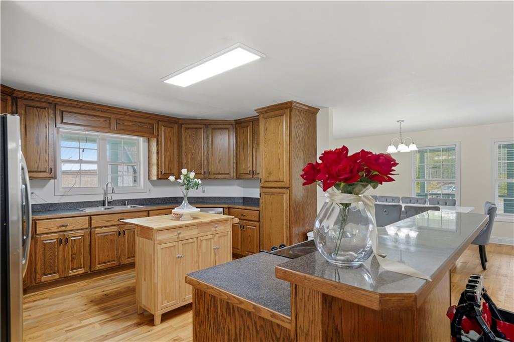 262 Iron Hill Road Taylorsville, GA 30178 - Photo 9 of 38 a view of a kitchen with kitchen island stainless steel appliances a sink and cabinets
