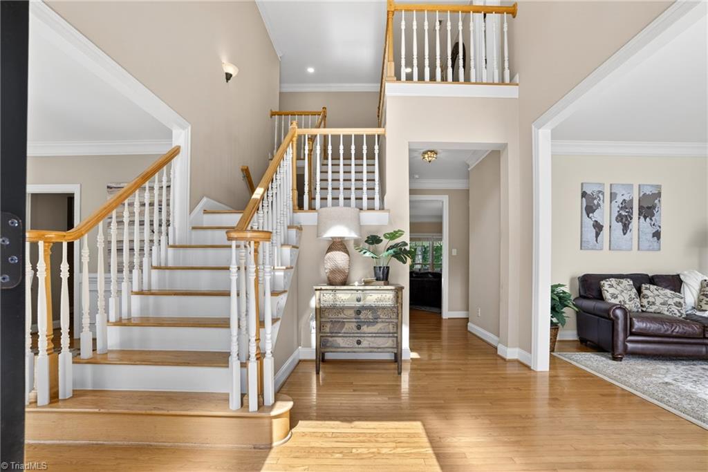 8508 Rosedale Drive Oak Ridge, NC 27310 - Photo 8 of 50 A soaring two-story welcome the moment you step in.