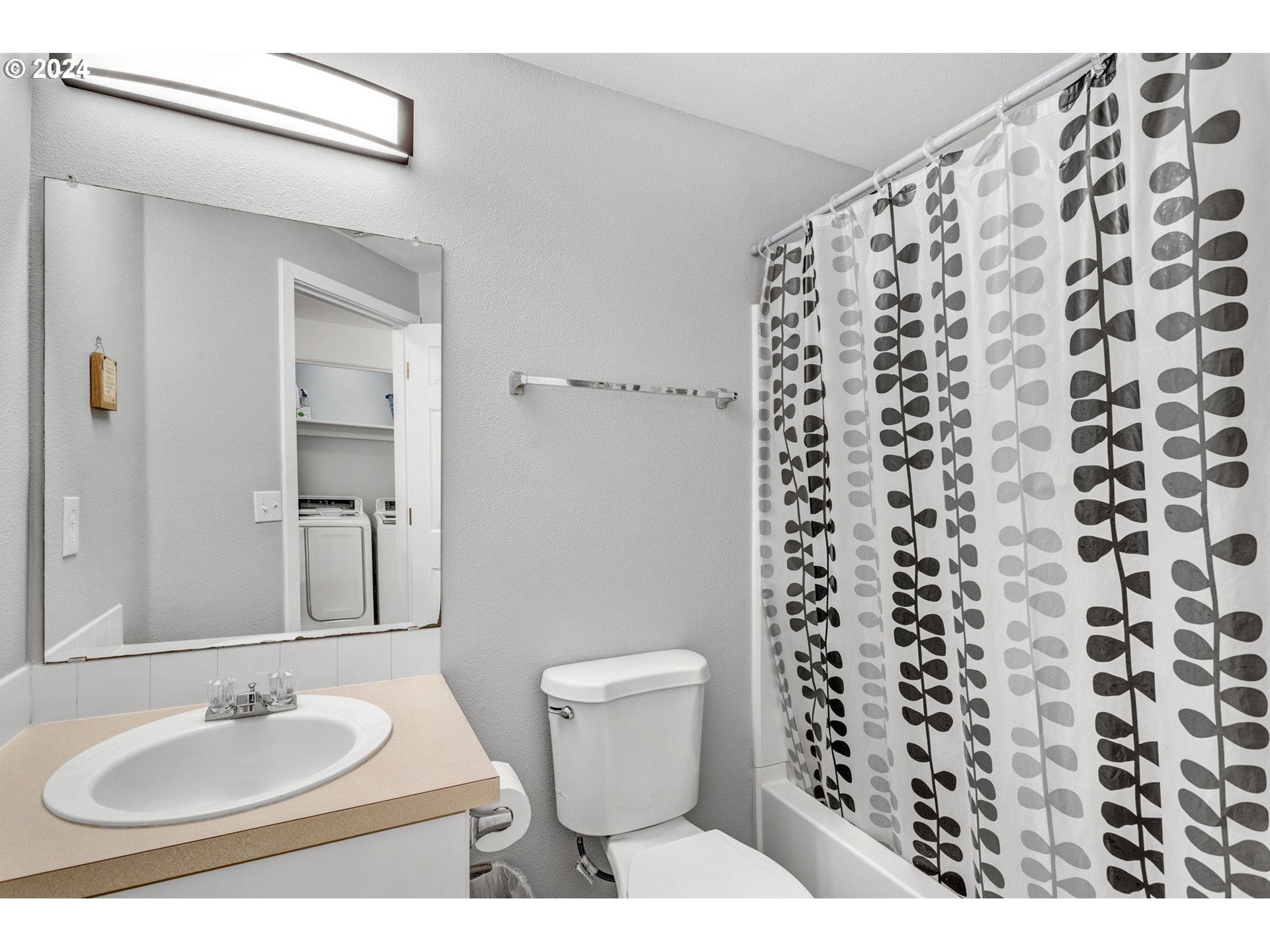 4083 Southwest 182nd Place Beaverton, OR 97078 - Photo 24 of 33 a bathroom with a sink and a mirror