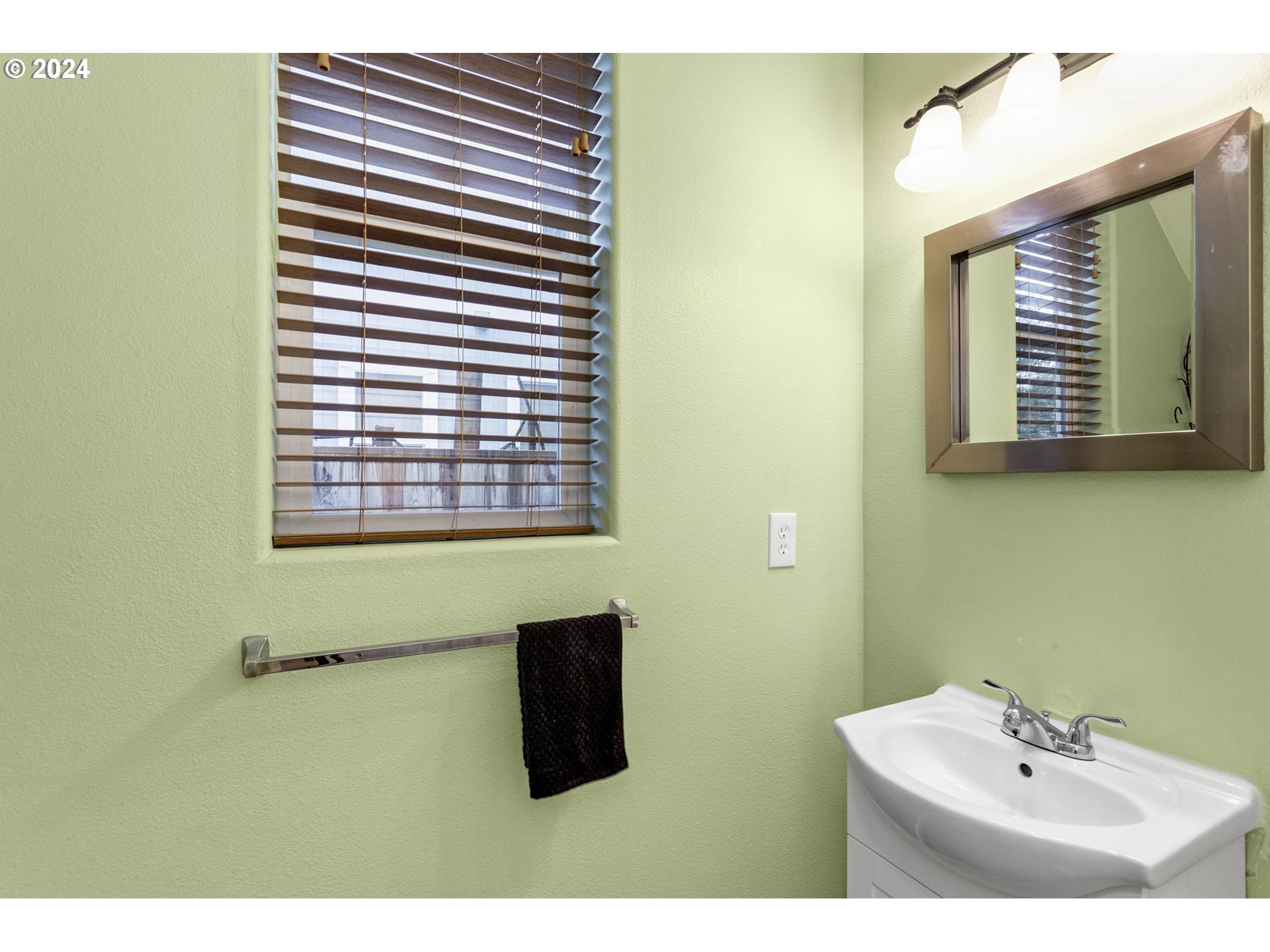 4083 Southwest 182nd Place Beaverton, OR 97078 - Photo 33 of 33 a bathroom with a sink and a mirror