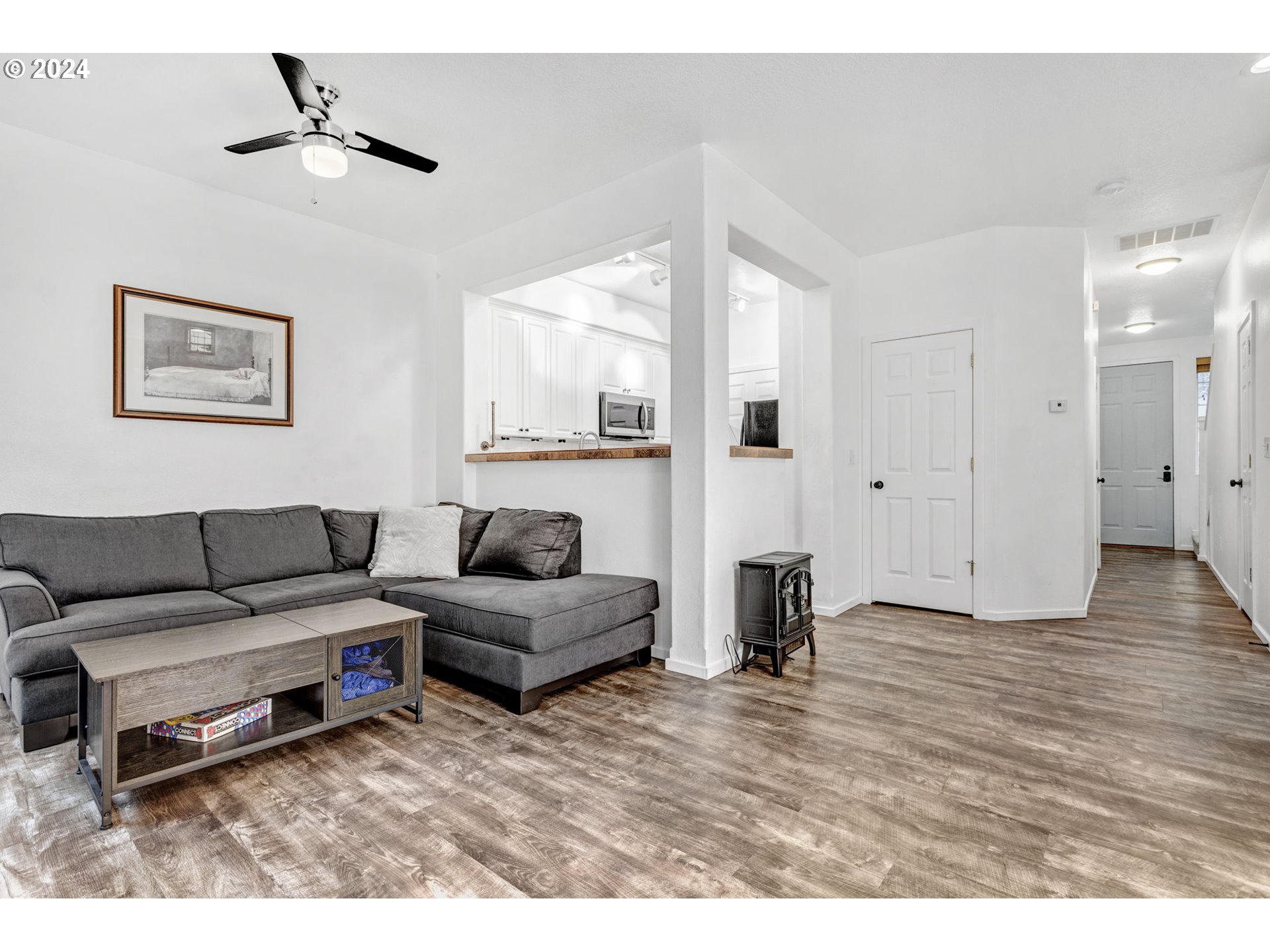 4083 Southwest 182nd Place Beaverton, OR 97078 - Photo 5 of 33 a living room with furniture and a wooden floor