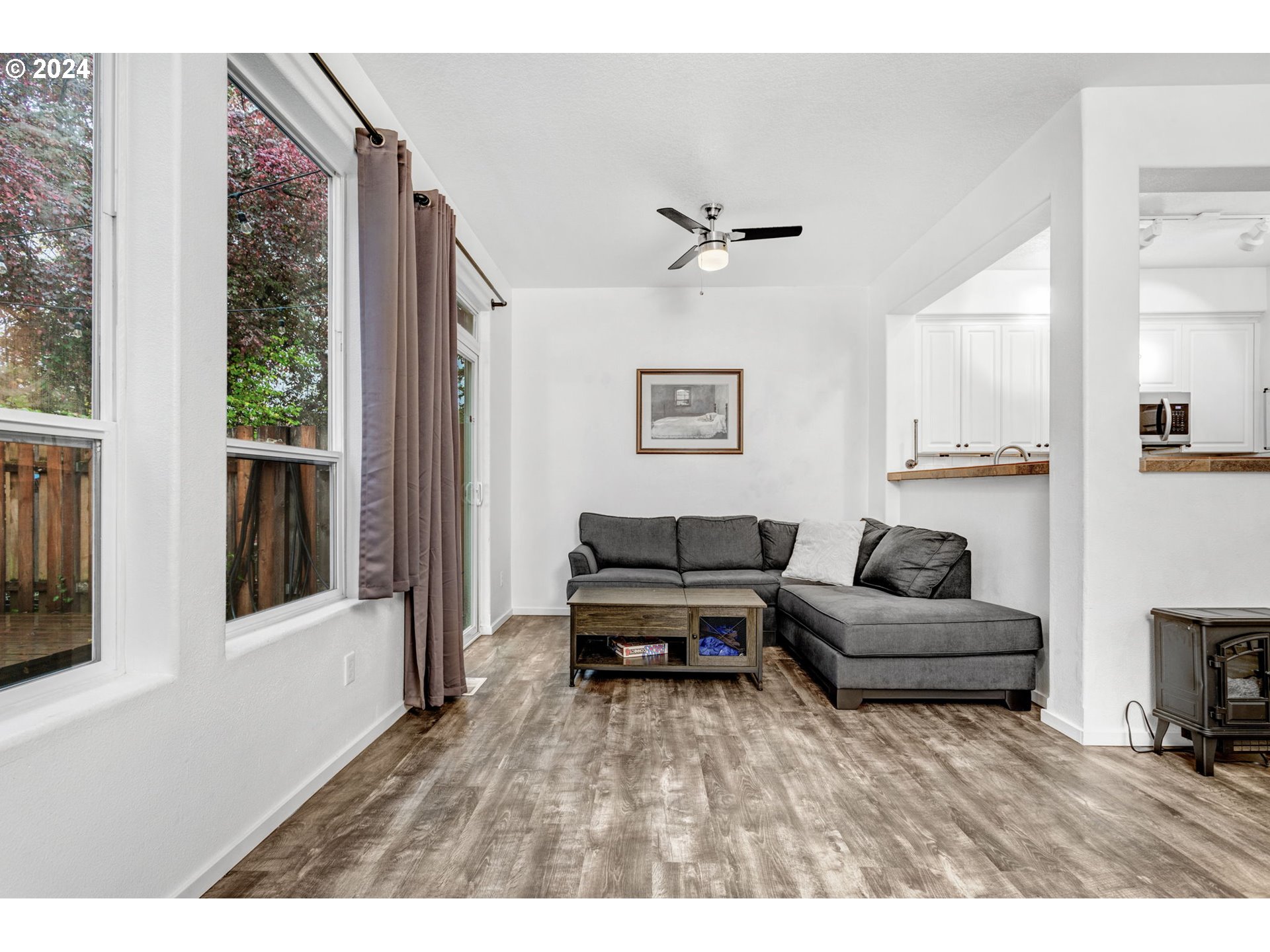 4083 Southwest 182nd Place Beaverton, OR 97078 - Photo 6 of 33 a living room with furniture and a wooden floor