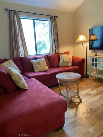 a bedroom with a bed and a chair