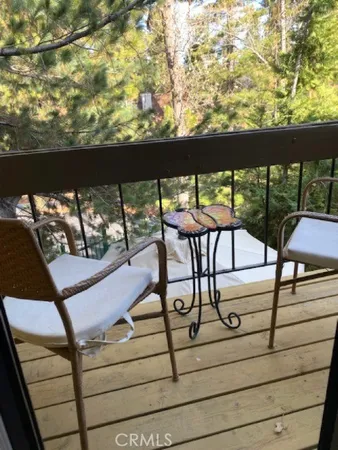 a view of a balcony with chairs