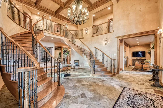 a kitchen with kitchen island granite countertop lots of counter top space and stainless steel appliances
