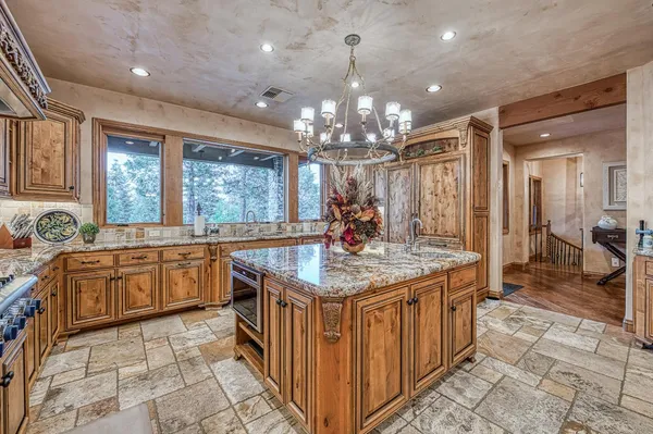 a bathroom with a granite countertop sink mirror and shower
