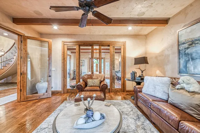 a backyard of a house with barbeque oven table and chairs
