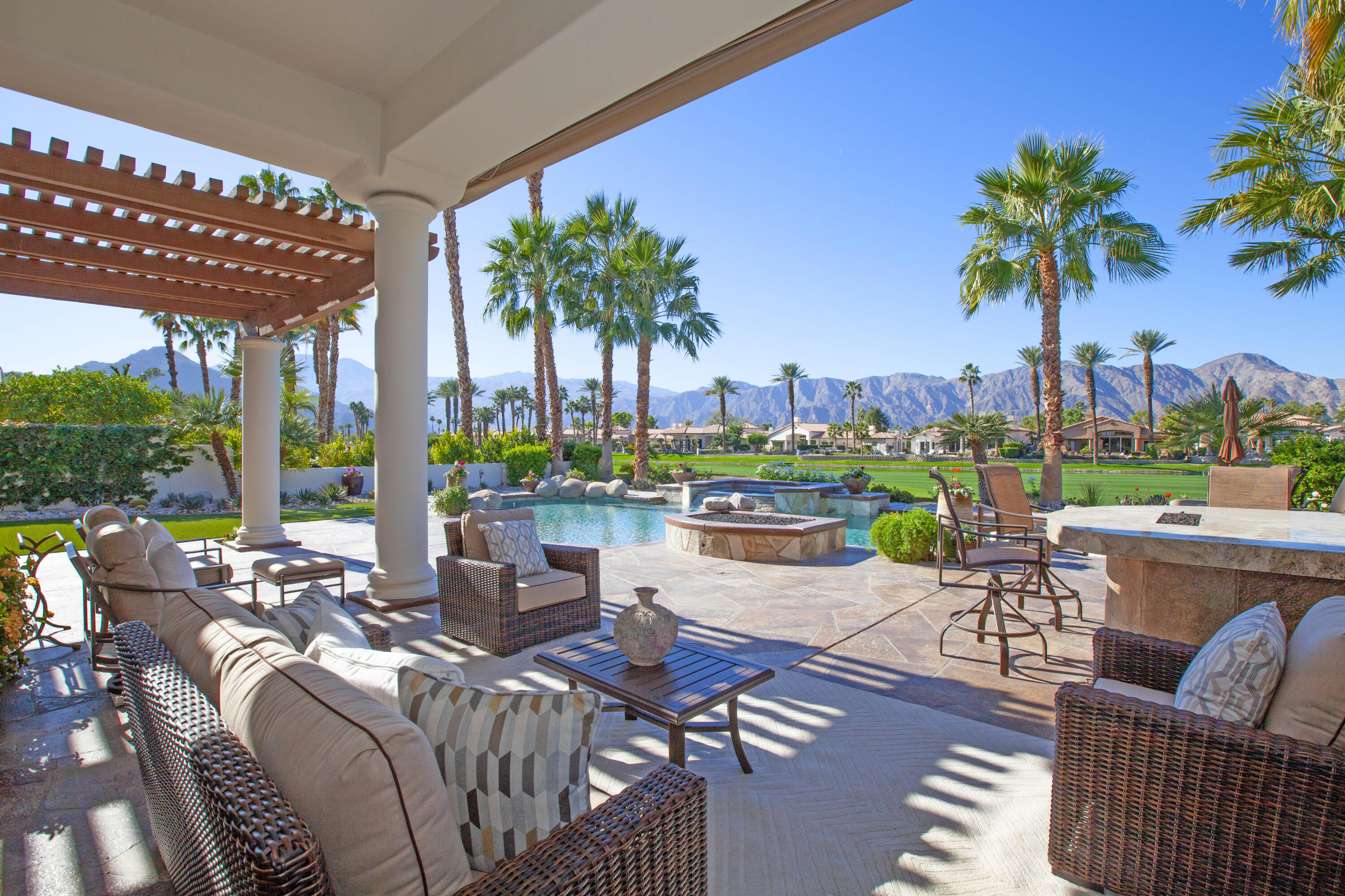 a balcony with furniture and a garden