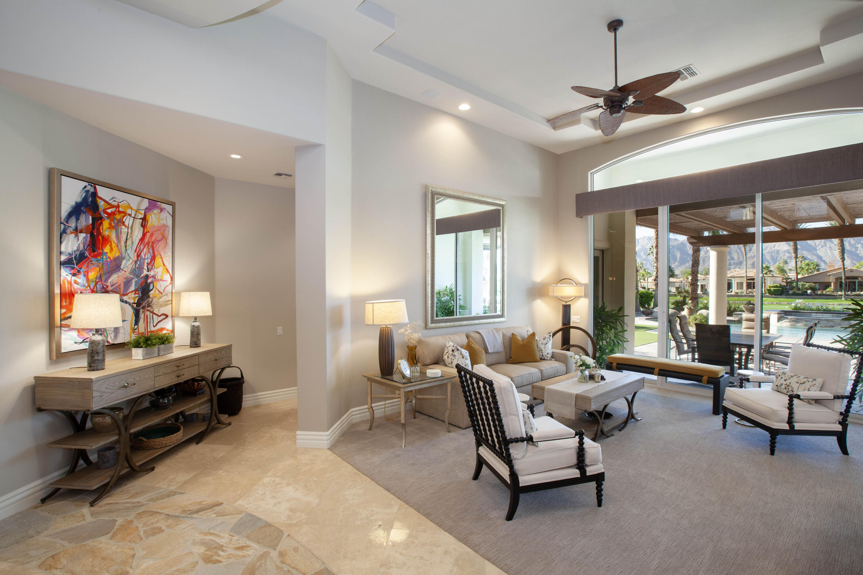 49487 Vía Conquistador La Quinta, CA 92253 - Photo 20 of 49 a living room with furniture gym equipment and a large window