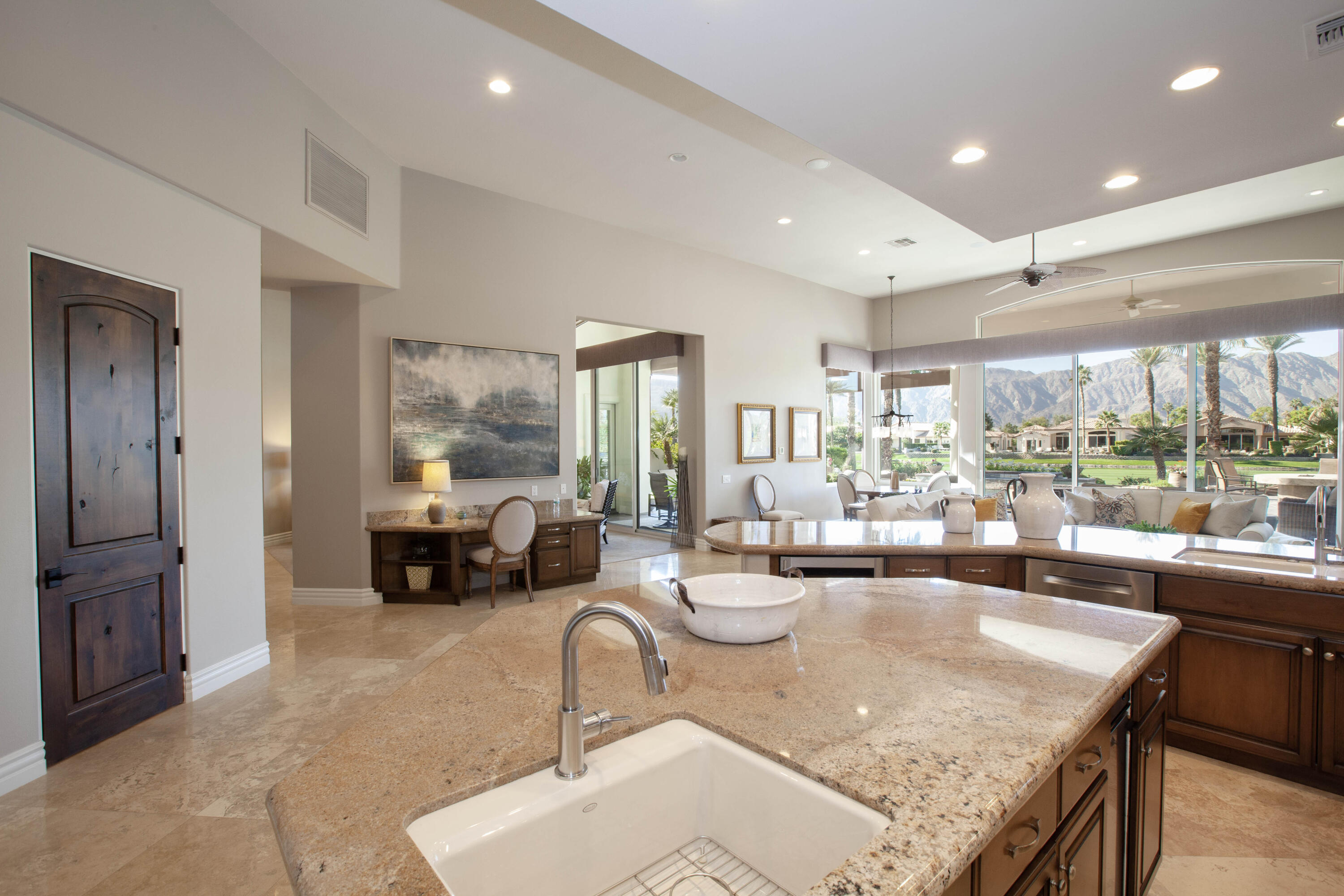 49487 Vía Conquistador La Quinta, CA 92253 - Photo 28 of 49 a very nice looking living room with a large window and a dining table