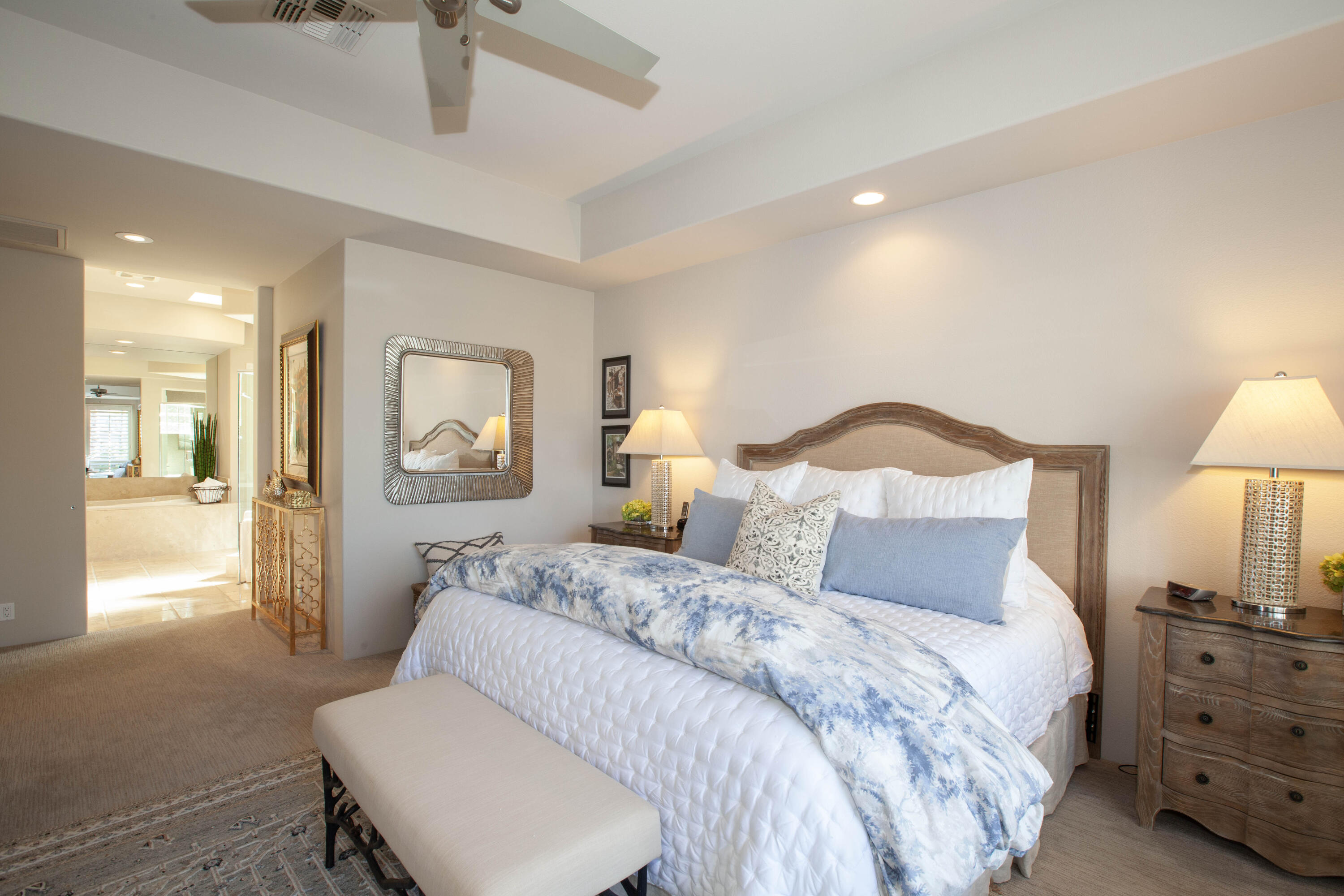 49487 Vía Conquistador La Quinta, CA 92253 - Photo 35 of 49 a bedroom with a bed and a lamp