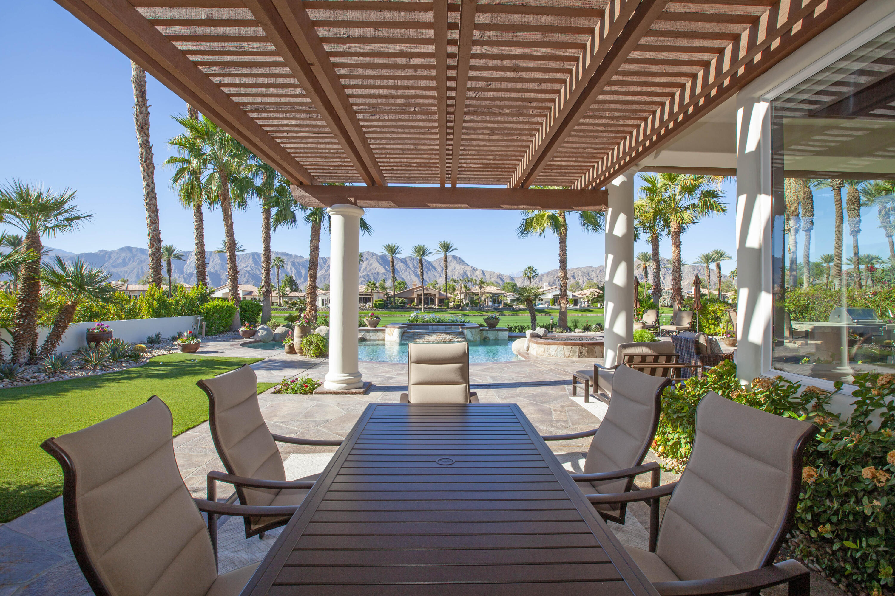 49487 Vía Conquistador La Quinta, CA 92253 - Photo 4 of 49 a view of a patio with couches potted plants and a patio