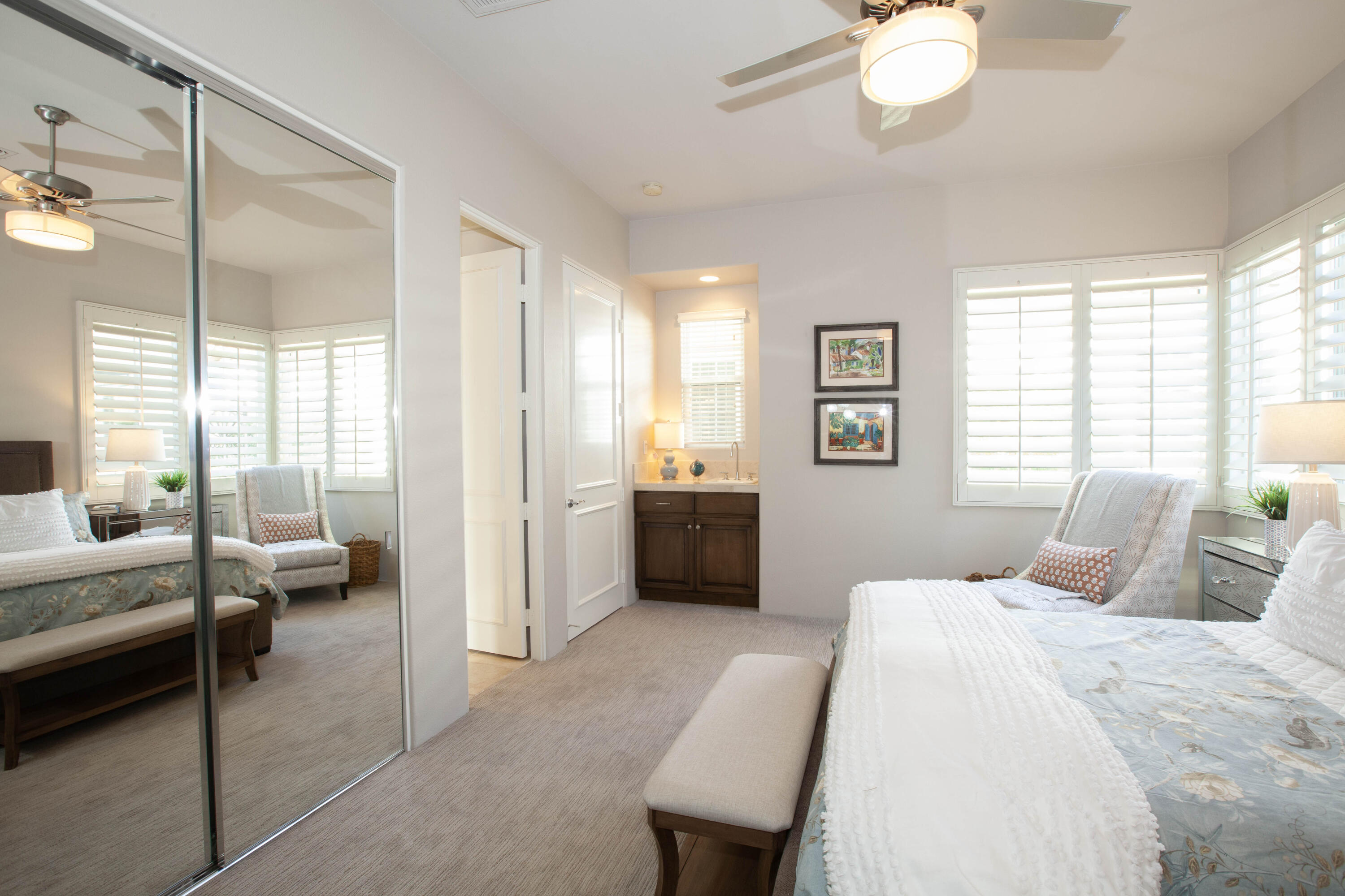 49487 Vía Conquistador La Quinta, CA 92253 - Photo 41 of 49 a bedroom with a bed mirror and a balcony