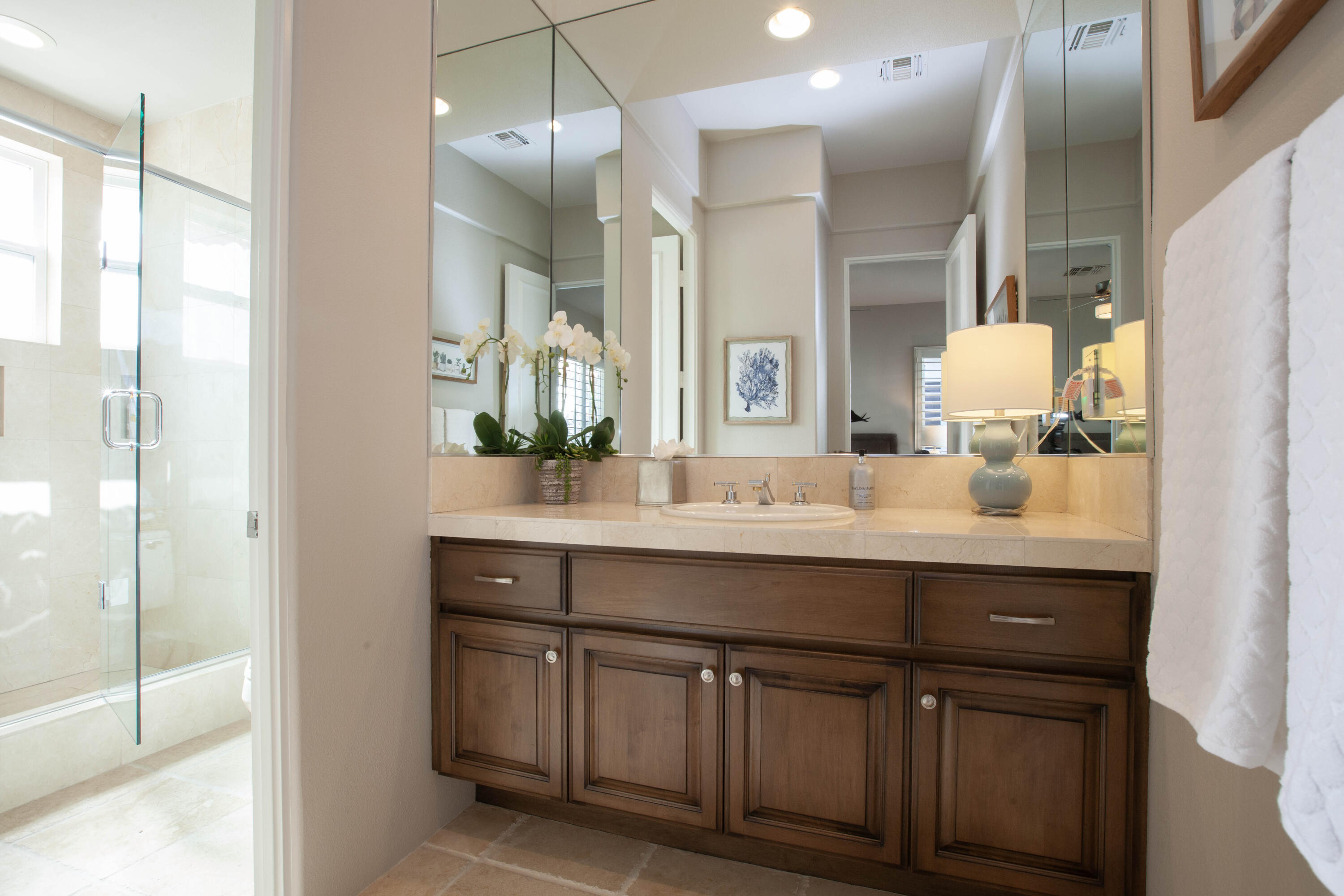 49487 Vía Conquistador La Quinta, CA 92253 - Photo 42 of 49 a bathroom with a double vanity sink and a mirror