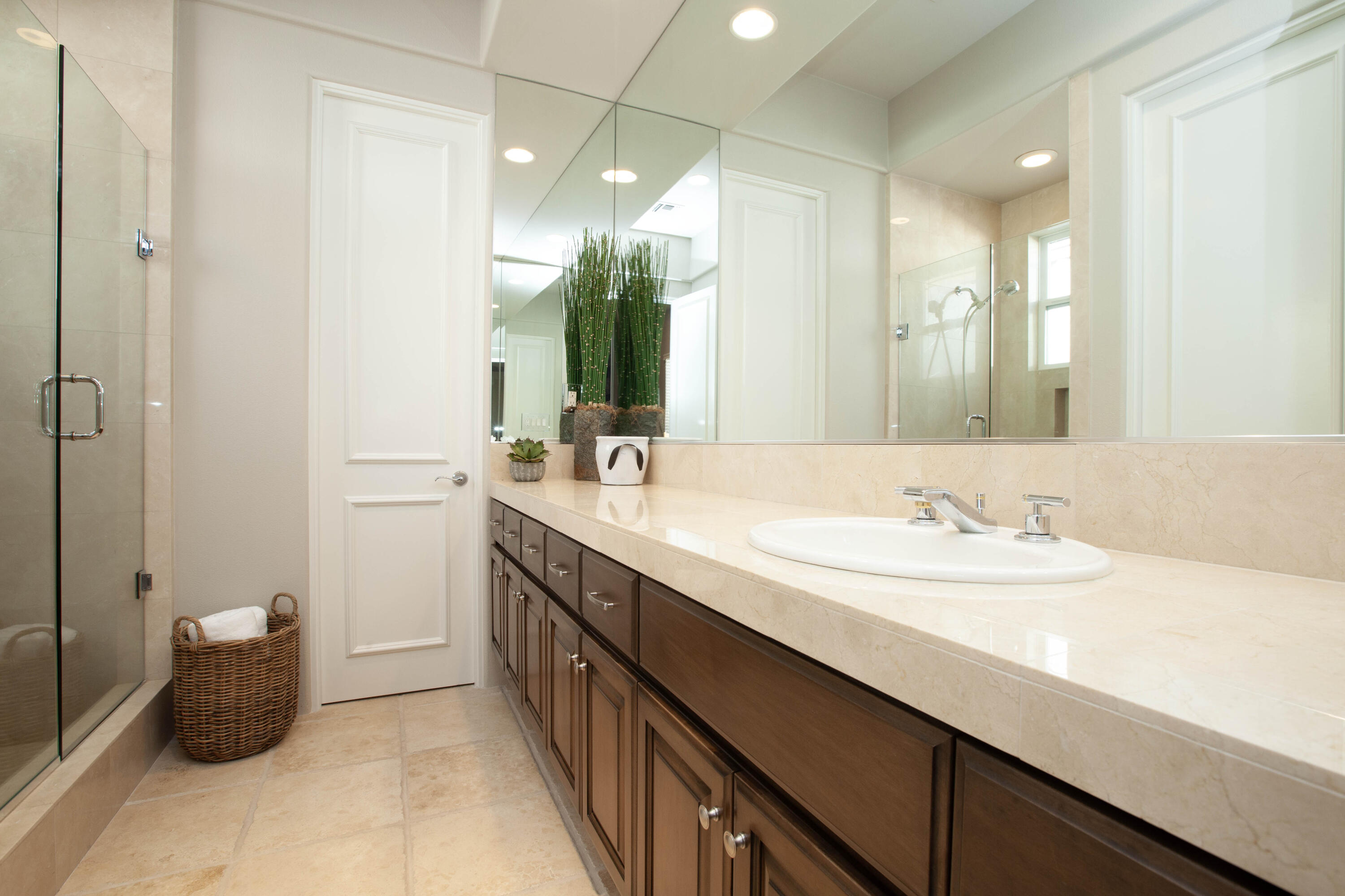 49487 Vía Conquistador La Quinta, CA 92253 - Photo 44 of 49 a bathroom with a double vanity sink and a mirror