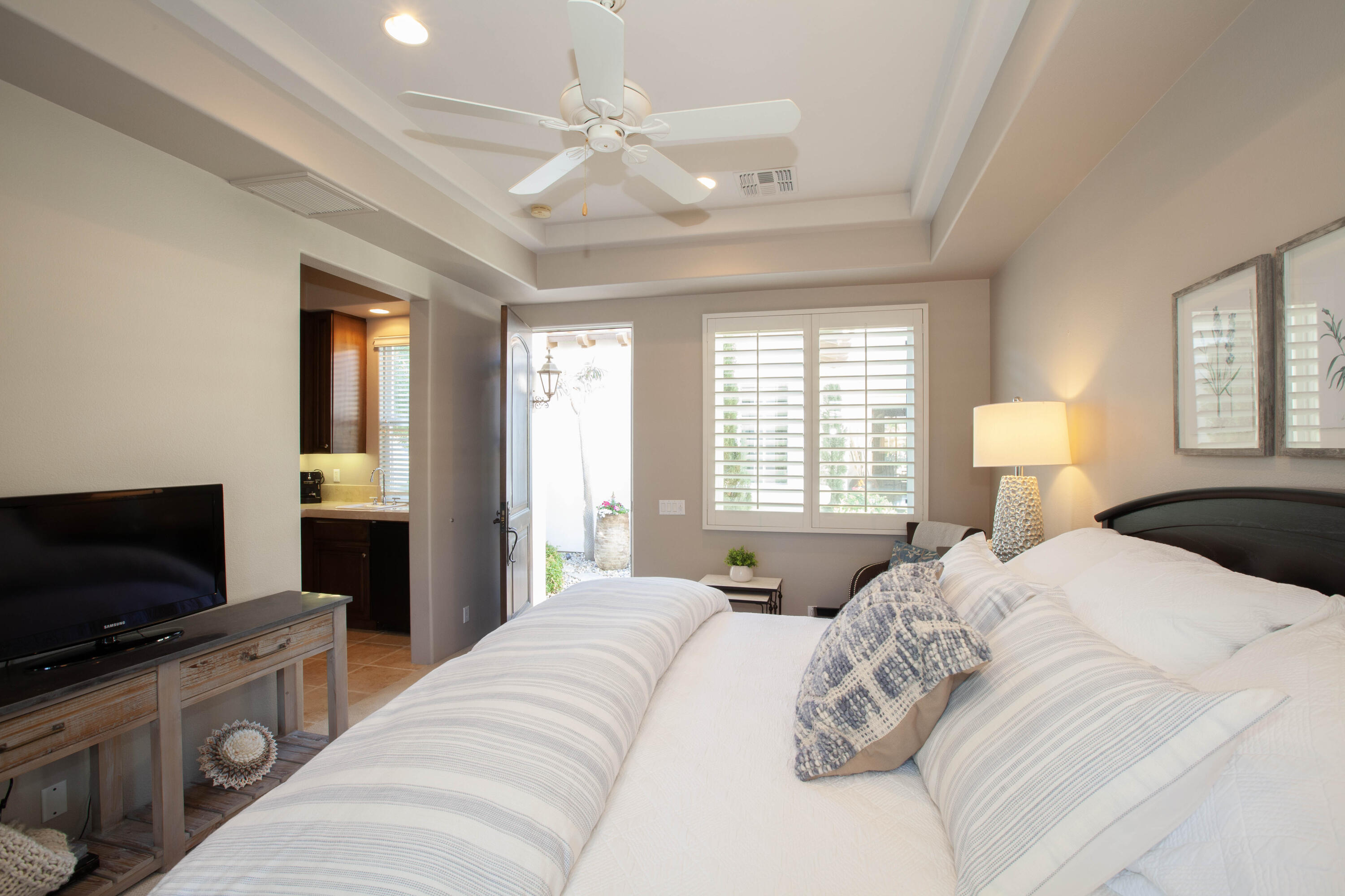 49487 Vía Conquistador La Quinta, CA 92253 - Photo 47 of 49 a bedroom with a bed and a flat screen tv