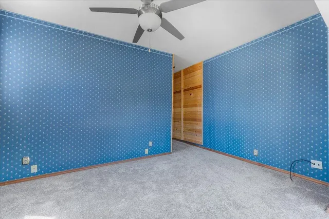 a view of a house with a snow in the background