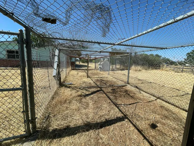 a view of a street with a building in the background