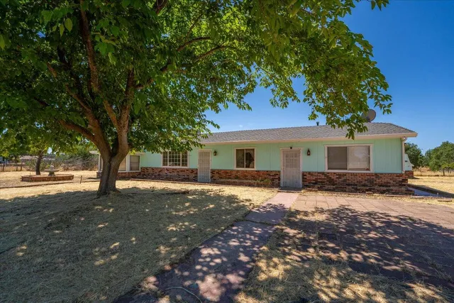 an empty room with closet and windows