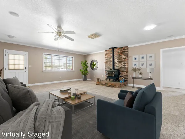 a view of a kitchen with a sink and dishwasher with wooden floor