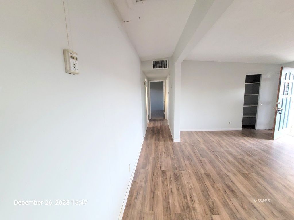 439 West Reeves Avenue Ridgecrest, CA 93555 - Photo 8 of 20 a view of hallway with wooden floor