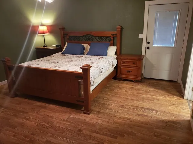 a bedroom with a bed and a dresser