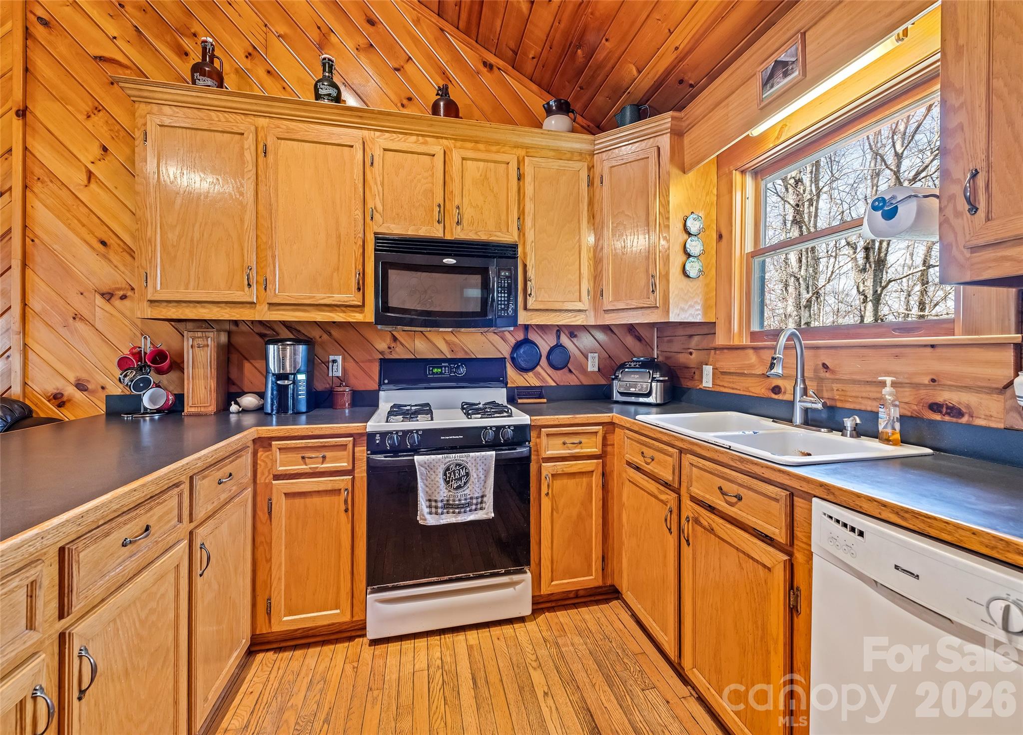 173 Blizzard Ridge Maggie Valley, NC 28751 - Photo 11 of 37 a kitchen with stainless steel appliances granite countertop a stove a sink and a microwave