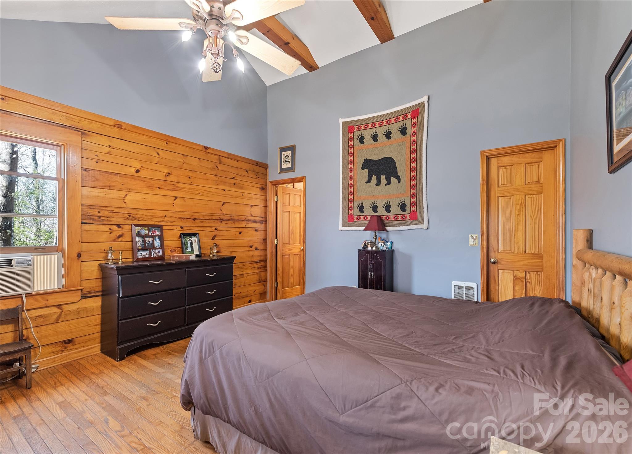 173 Blizzard Ridge Maggie Valley, NC 28751 - Photo 14 of 37 a bedroom with a bed and wooden floor