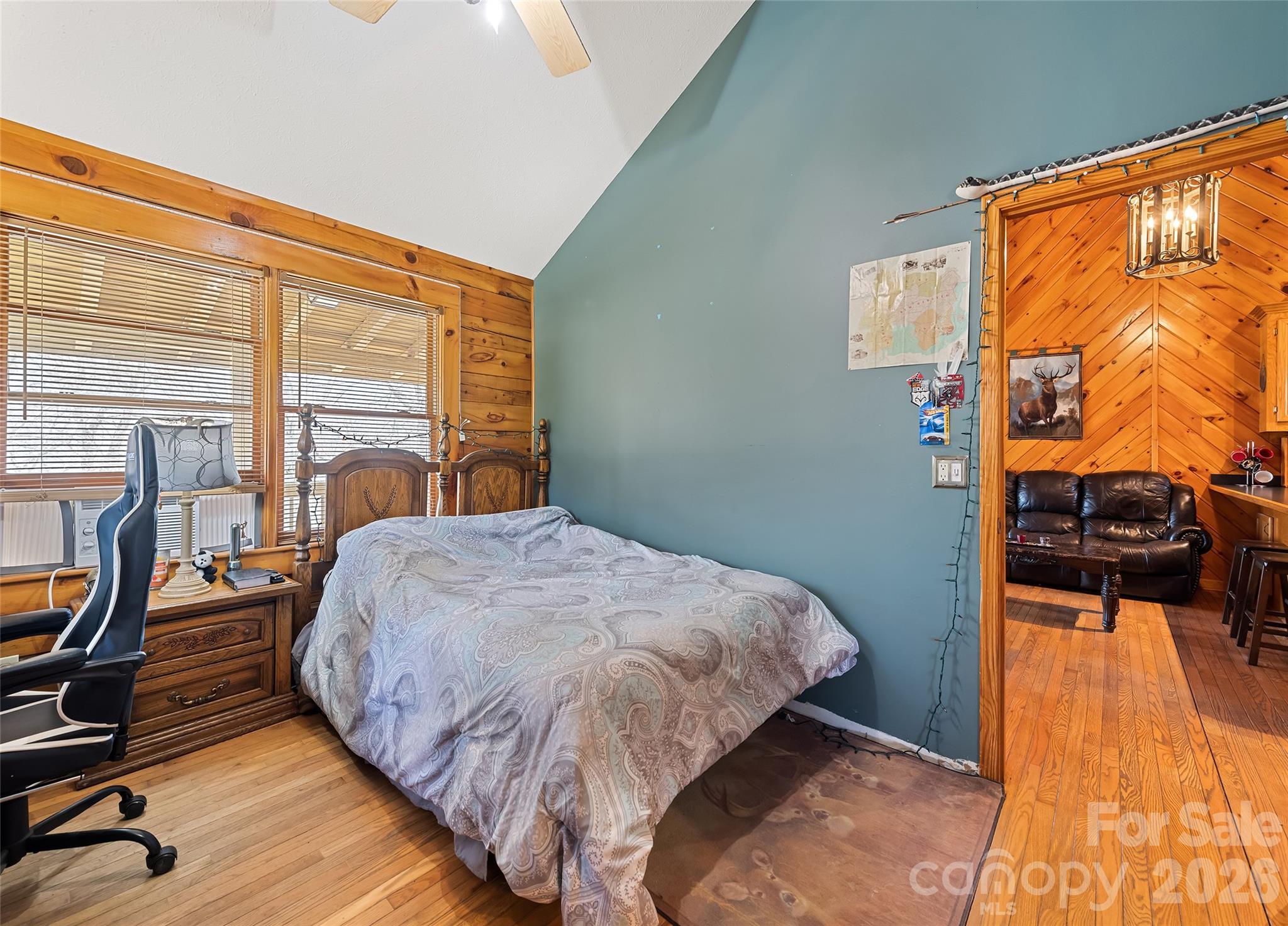 173 Blizzard Ridge Maggie Valley, NC 28751 - Photo 17 of 37 a bedroom with a bed and wooden floor