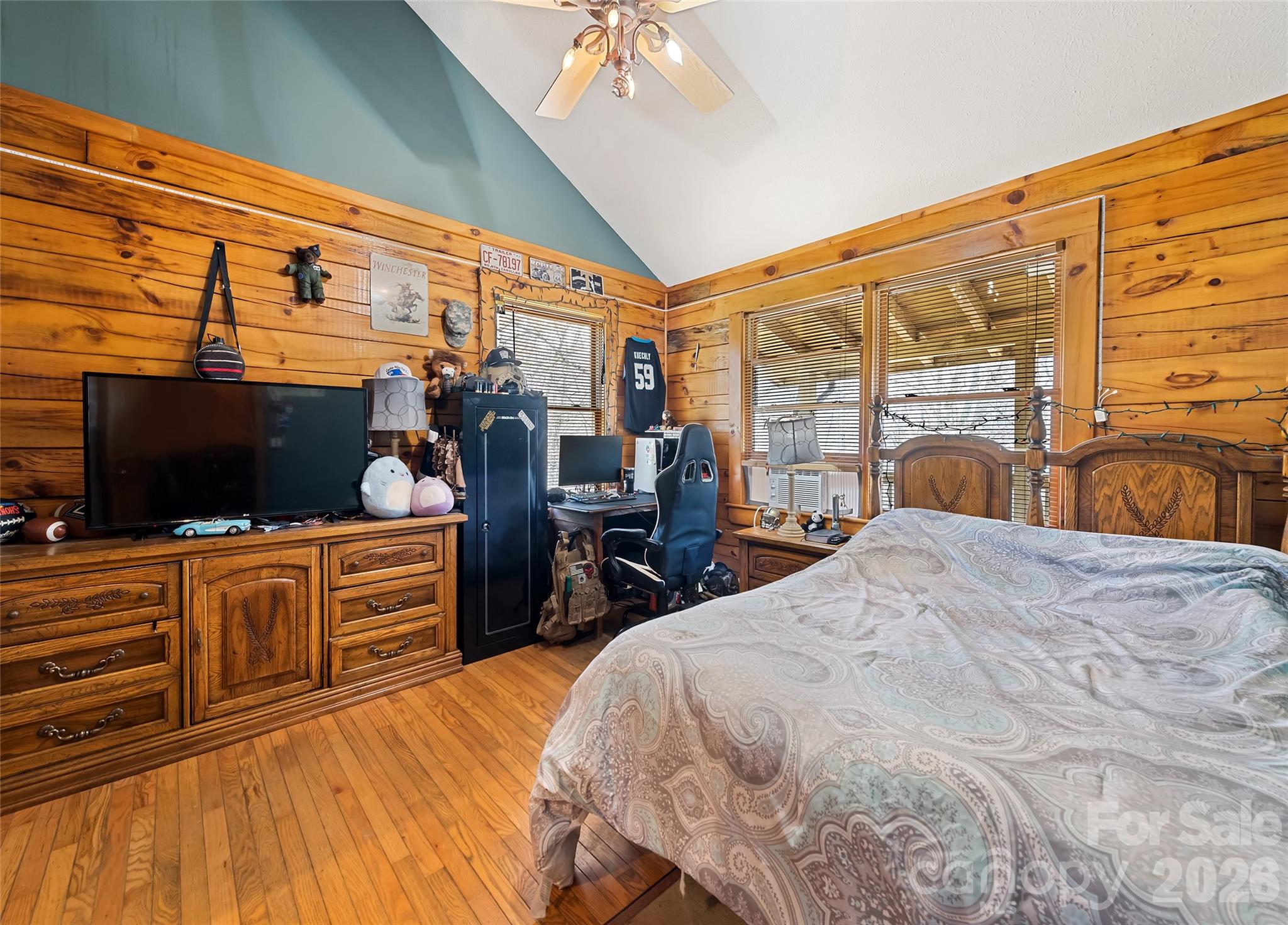 173 Blizzard Ridge Maggie Valley, NC 28751 - Photo 18 of 37 a bedroom with a bed and a flat tv screen on dresser