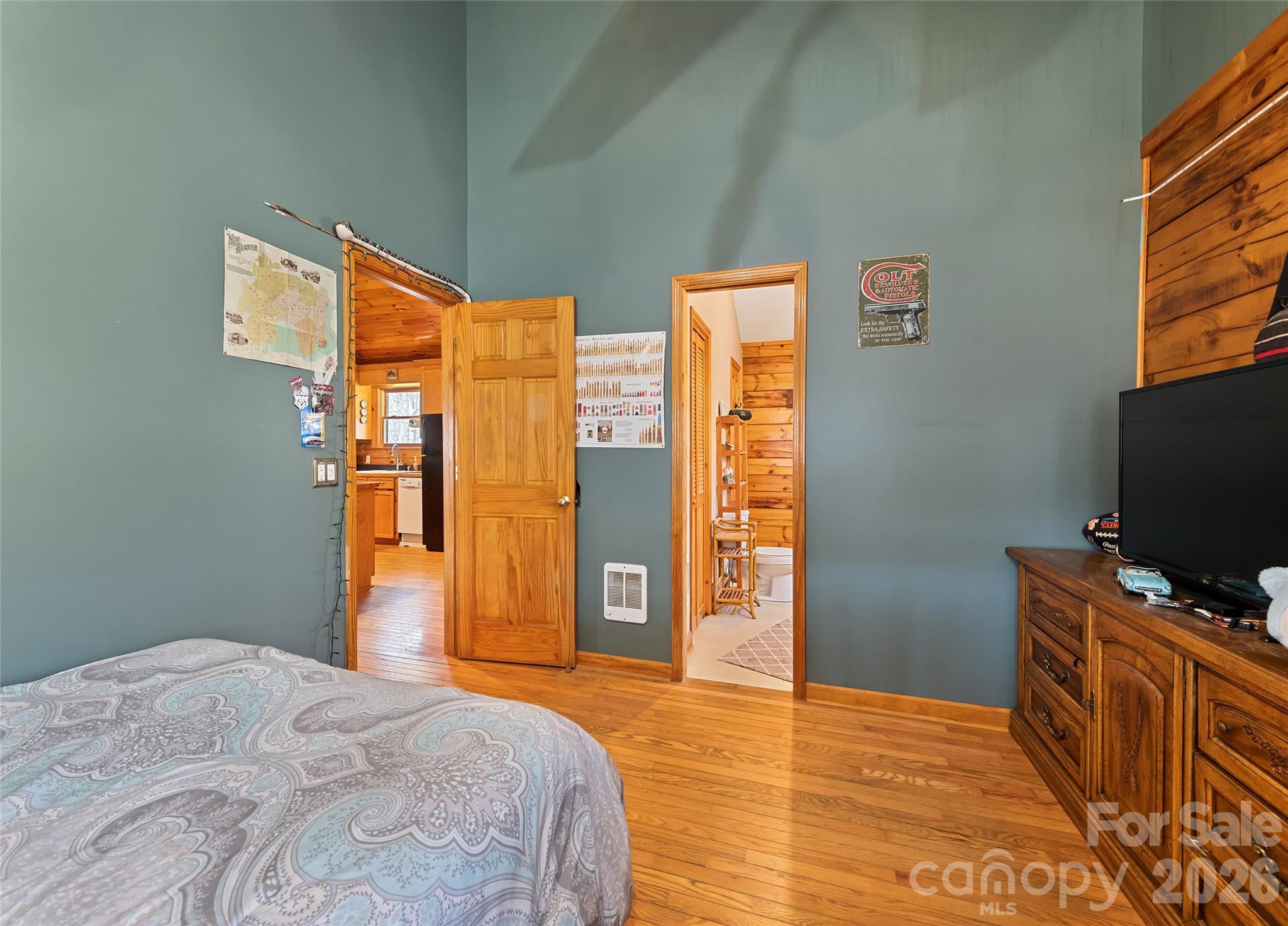 173 Blizzard Ridge Maggie Valley, NC 28751 - Photo 19 of 37 a bedroom with a bed and a flat screen tv