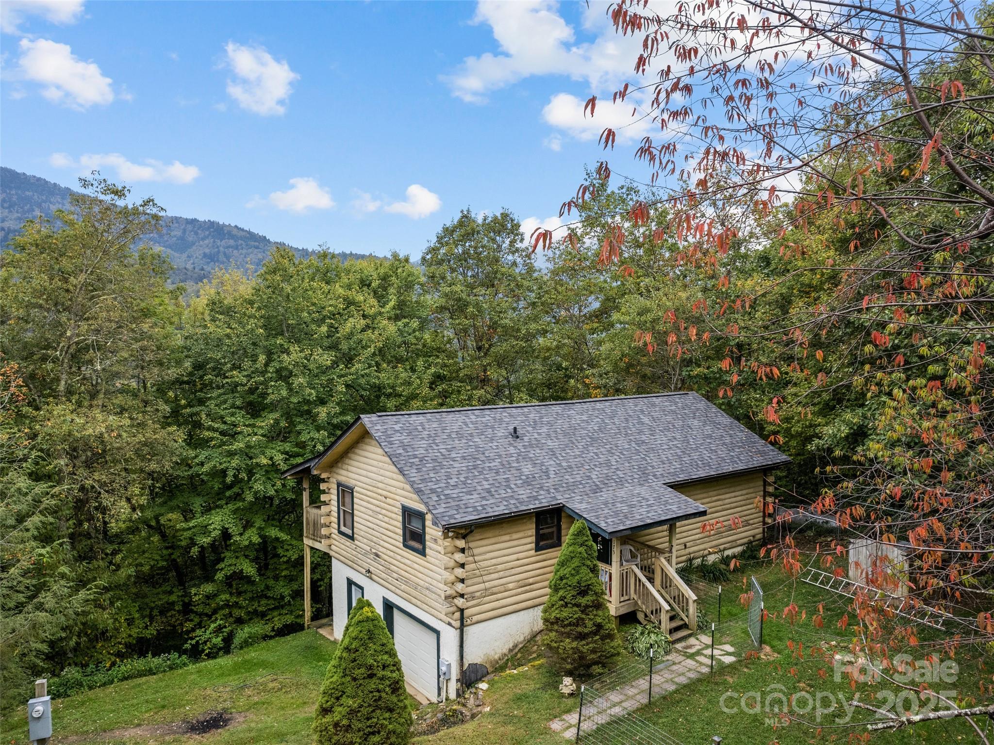 173 Blizzard Ridge Maggie Valley, NC 28751 - Photo 2 of 37 a view of backyard of house