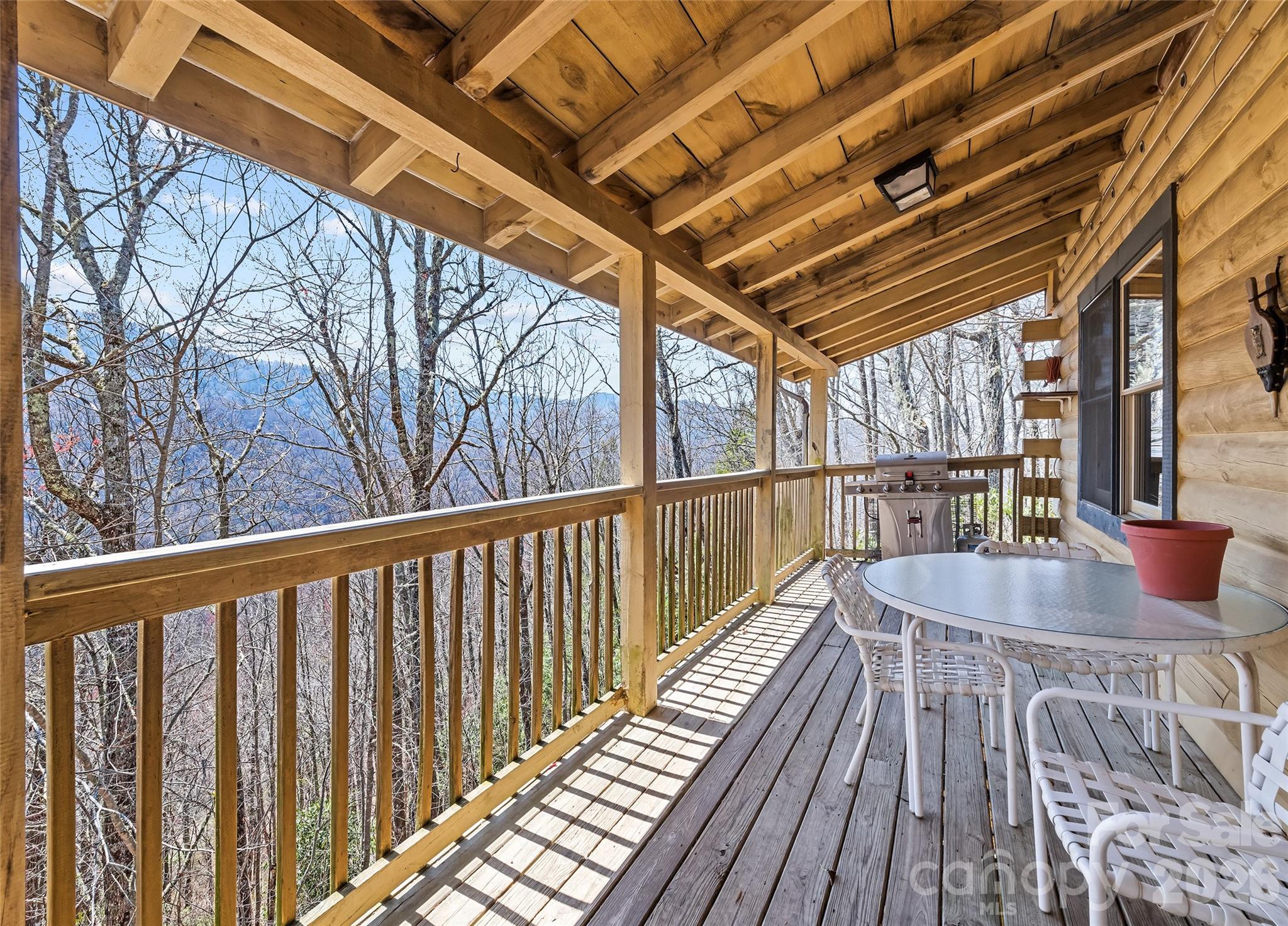 173 Blizzard Ridge Maggie Valley, NC 28751 - Photo 2 of 37 a balcony with wooden floor