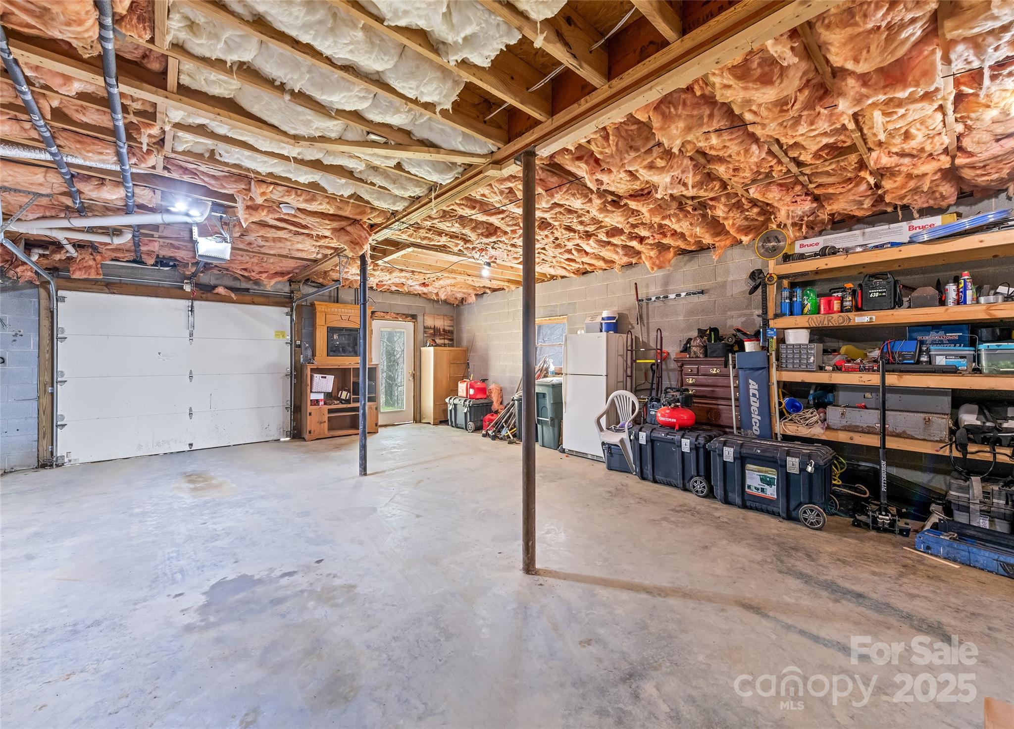 173 Blizzard Ridge Maggie Valley, NC 28751 - Photo 24 of 37 a view of a garage with rack and bicycle