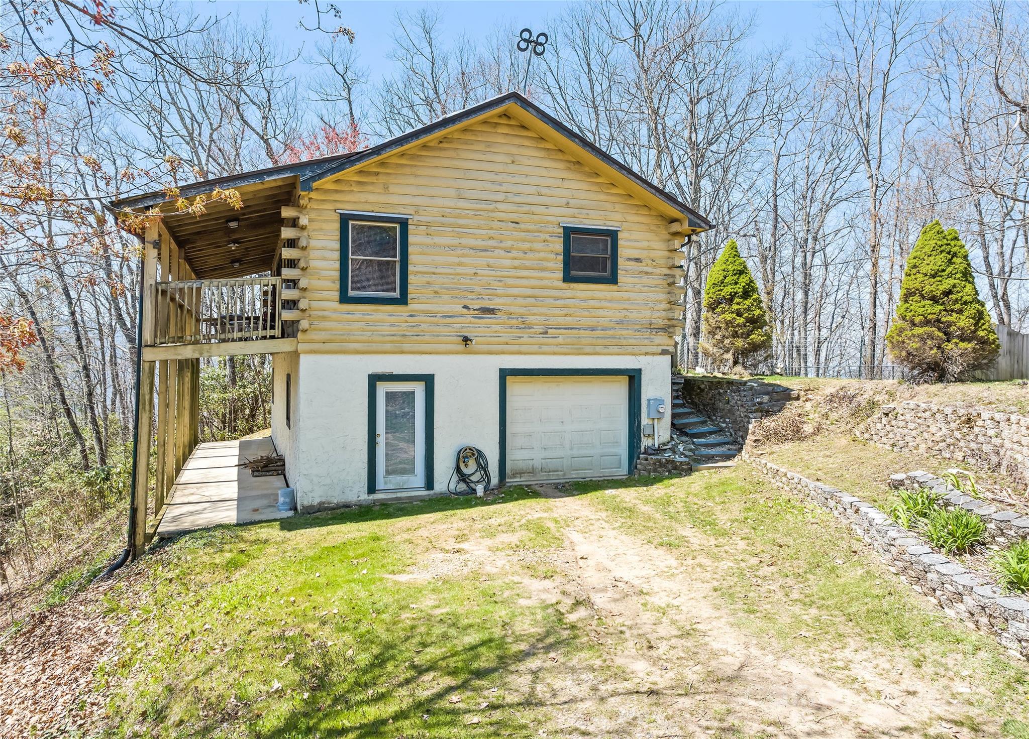 173 Blizzard Ridge Maggie Valley, NC 28751 - Photo 3 of 37 a view of a house with a yard